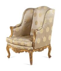 A Louis XV Style Carved Giltwood Bergère à Oreilles