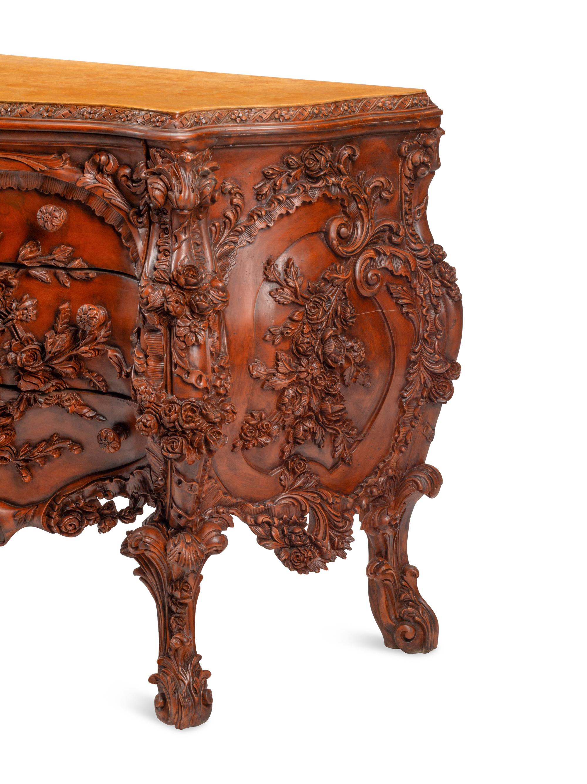 A Continental Floral-Carved and Painted Wood Commode