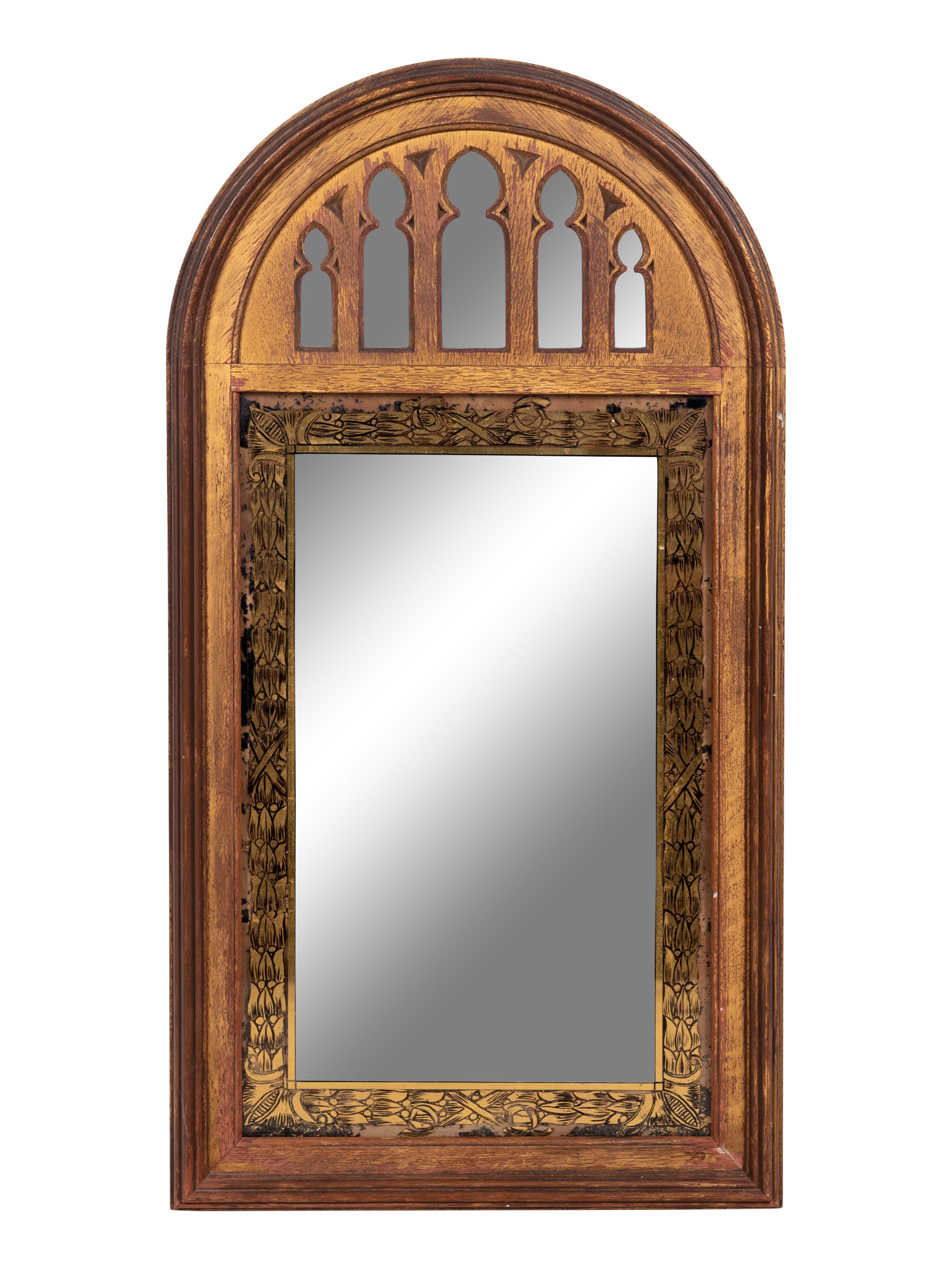 A Gothic Style Giltwood and Églomisé Mirror