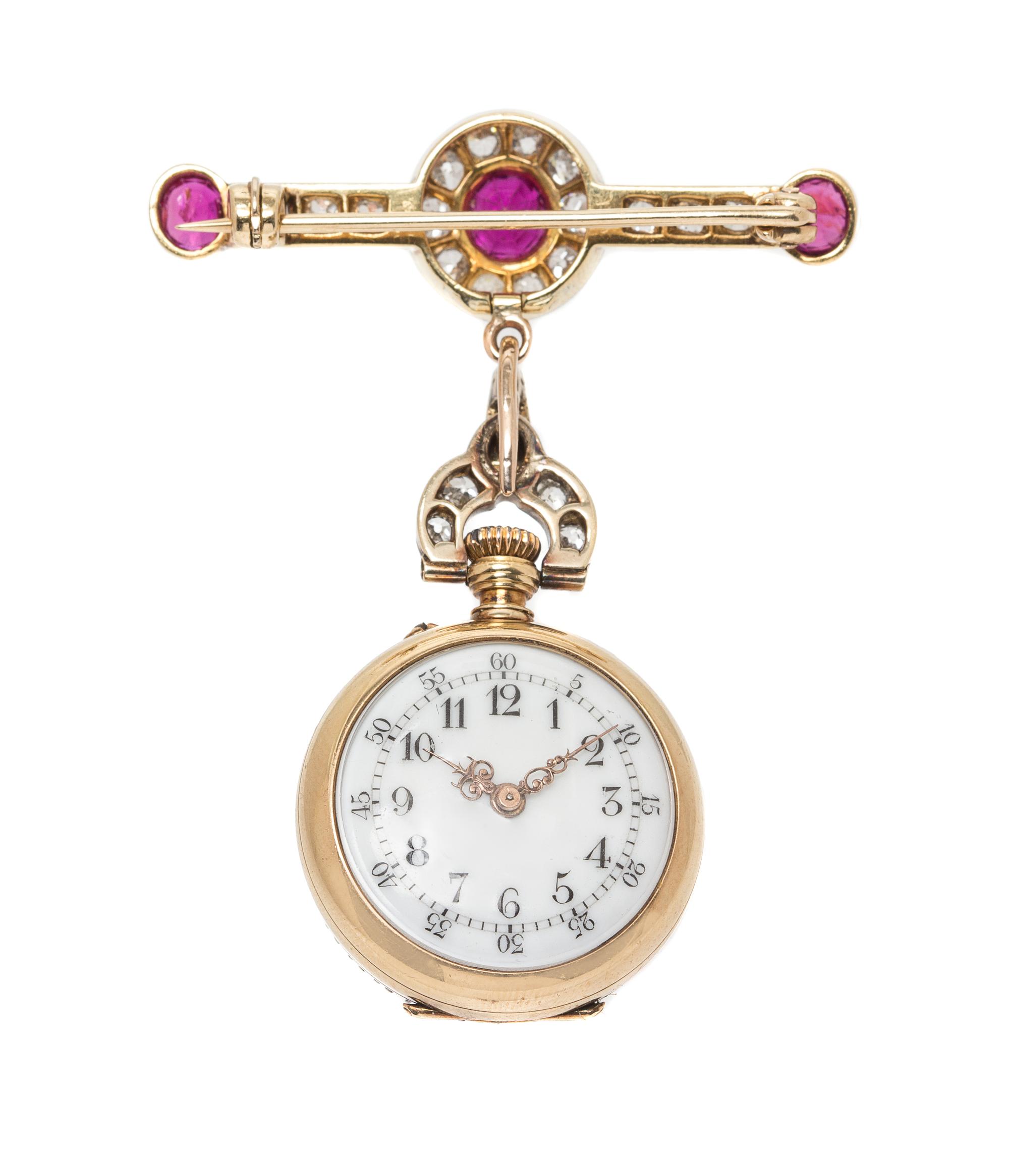 An Antique Platinum and Silver Topped Yellow Gold, Ruby and Diamond Open Face Lapel Watch, 20.40 dwts.