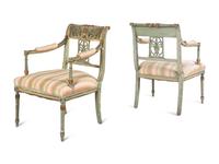 A Pair of Neoclassical Painted and Parcel Gilt Armchairs