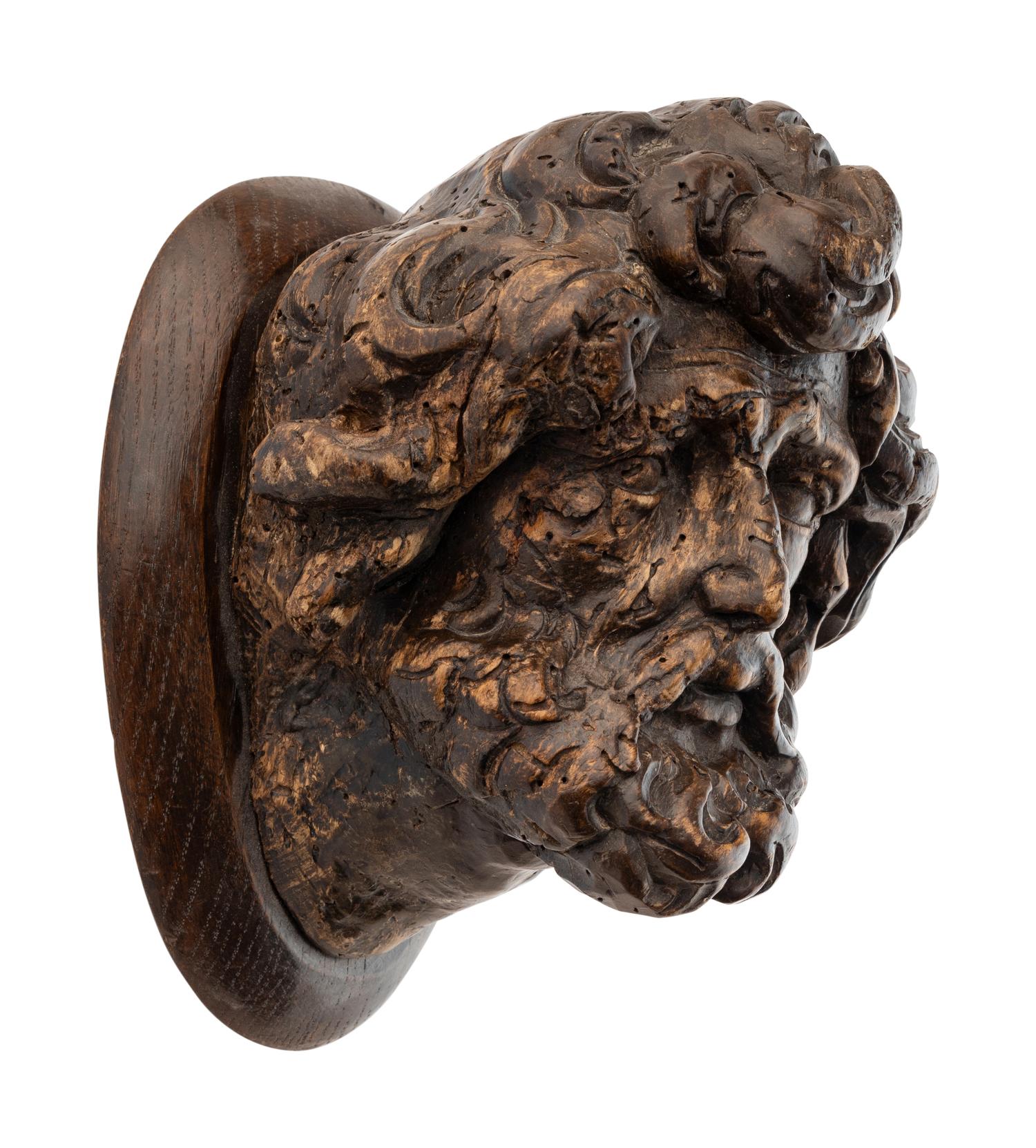 A Continental Carved Oak Head of a Saint