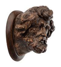 A Continental Carved Oak Head of a Saint