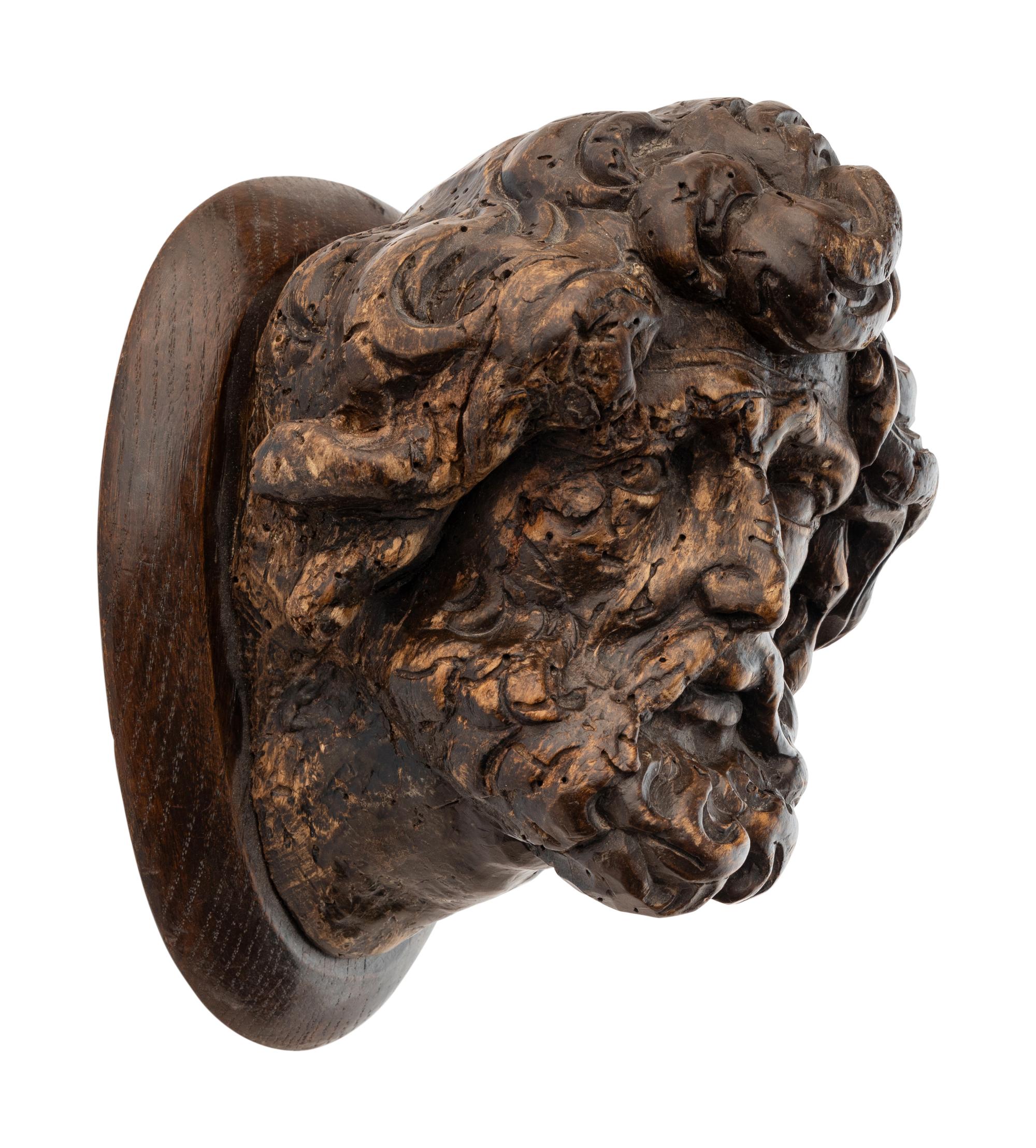 A Continental Carved Oak Head of a Saint
