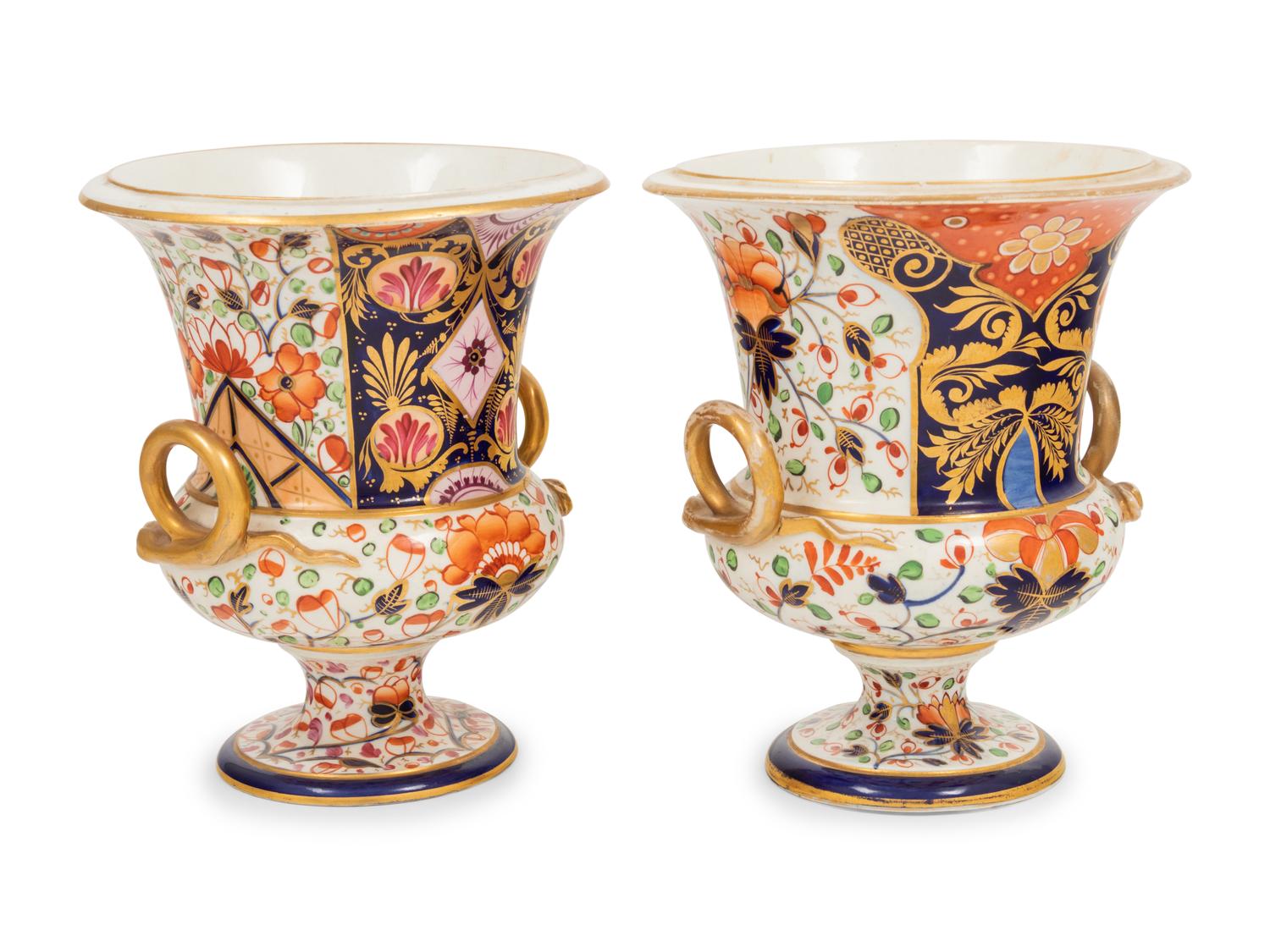 A Near Pair of Derby Porcelain Campagna Urns