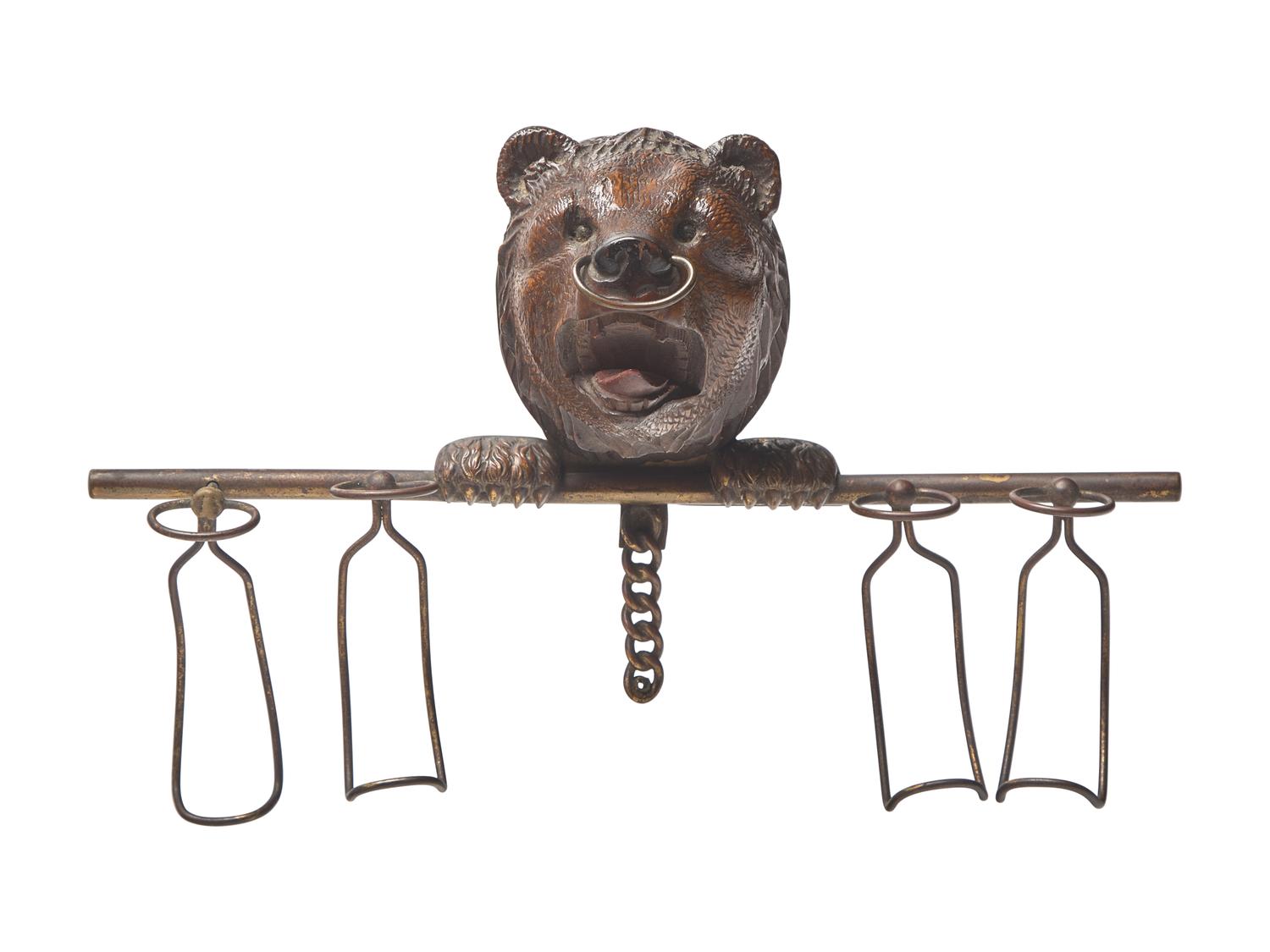 A Black Forest Carved Walnut Bear Form Spoon Rack