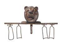 A Black Forest Carved Walnut Bear Form Spoon Rack