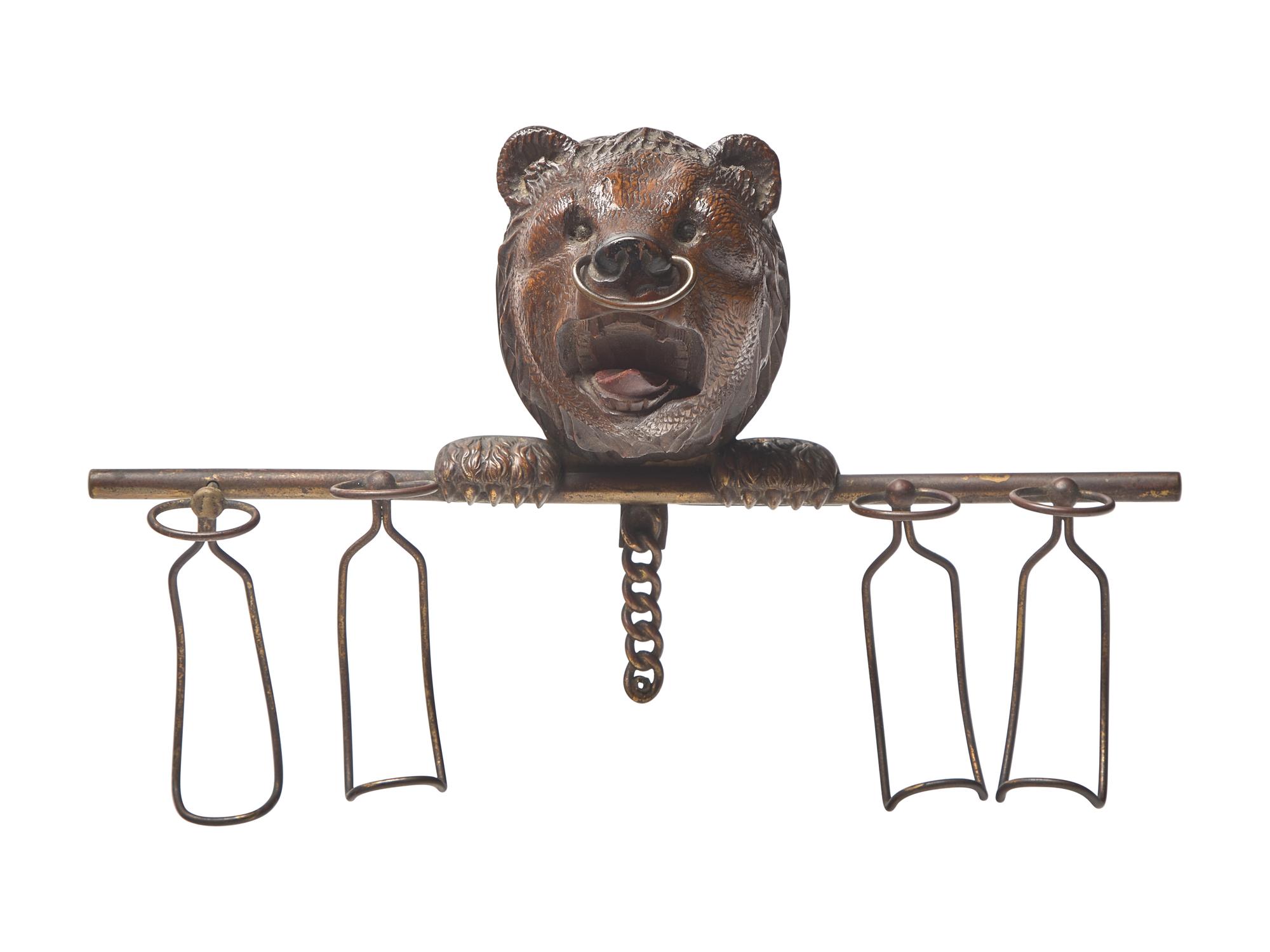 A Black Forest Carved Walnut Bear Form Spoon Rack