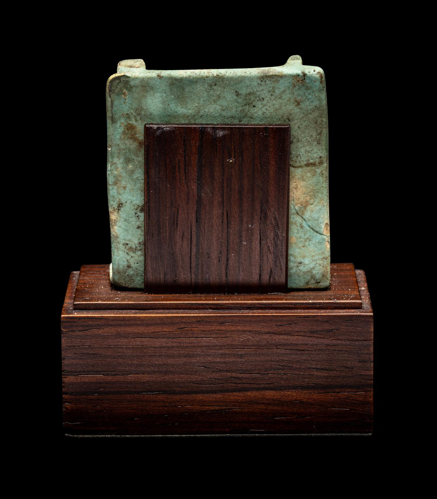 An Egyptian Faience Triad Amulet