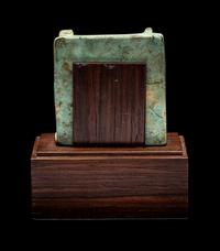 An Egyptian Faience Triad Amulet