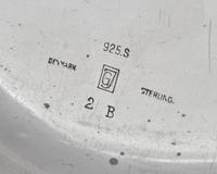 A Set of Nine Georg Jensen Silver Blossom Pattern Bread Plates