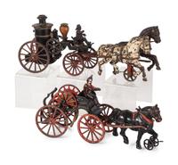 Two Cast Iron Horse Drawn Fire Wagons
