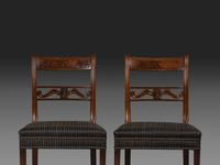 A Pair of Classical Carved and Figured Mahogany Klismos Side Chair