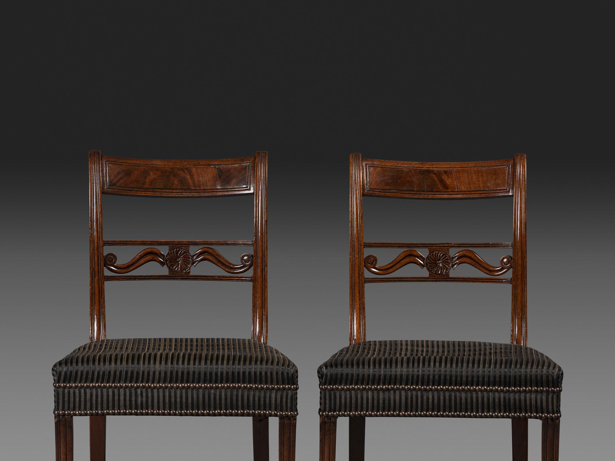 A Pair of Classical Carved and Figured Mahogany Klismos Side Chair