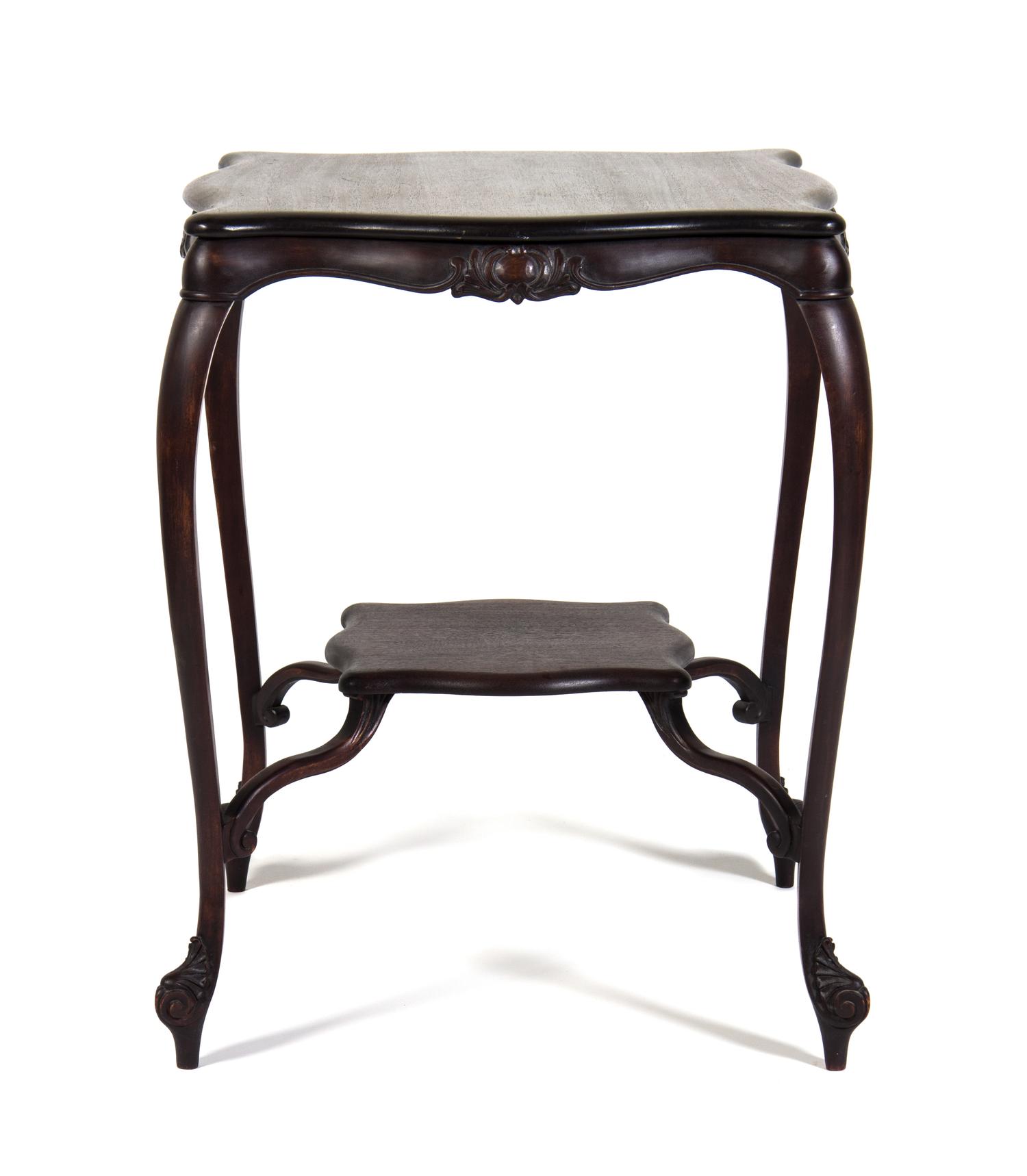 An Art Nouveau Style Mahogany Occasional Table Height 30 x width 24 x depth 24 inches.