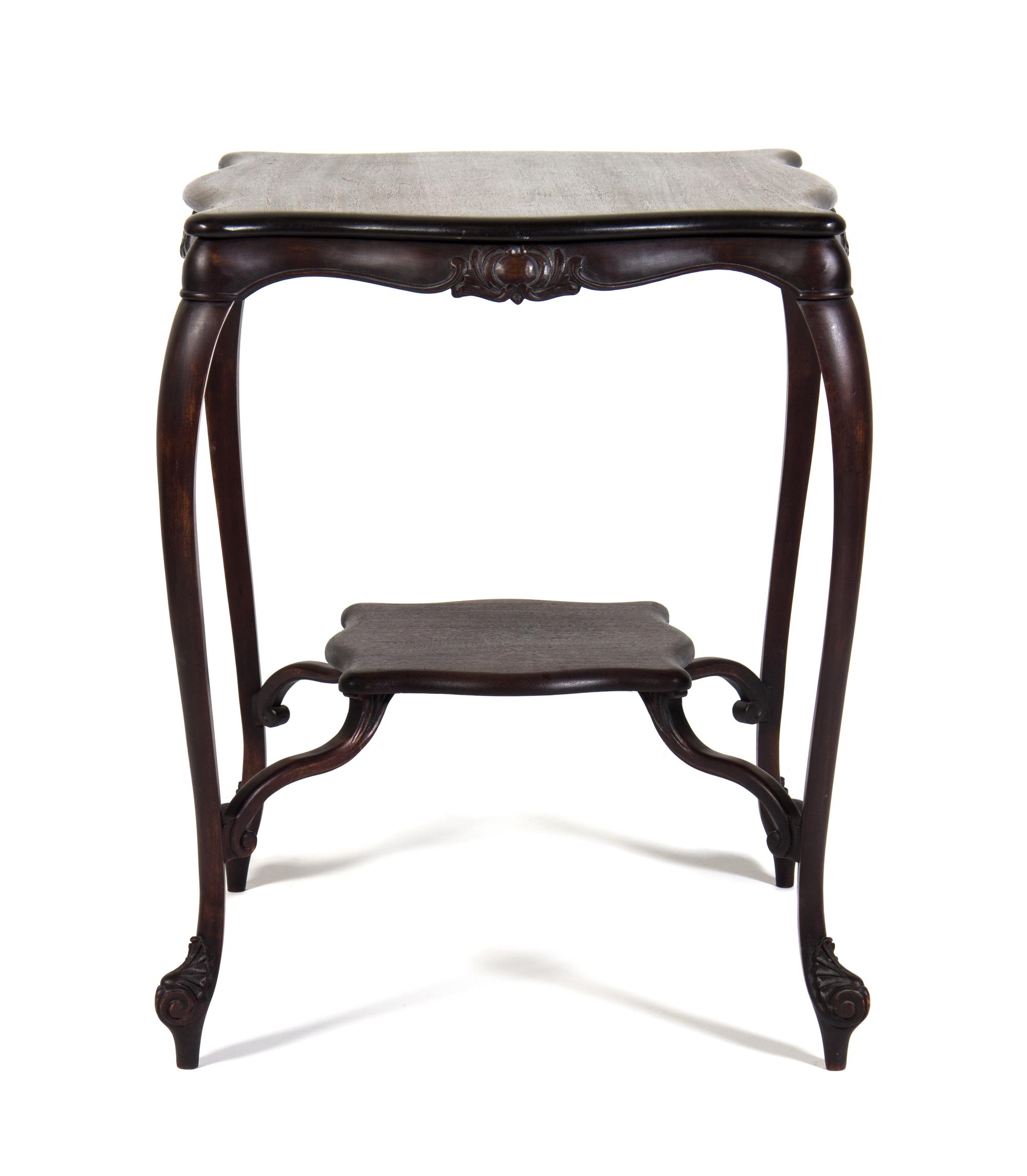An Art Nouveau Style Mahogany Occasional Table Height 30 x width 24 x depth 24 inches.