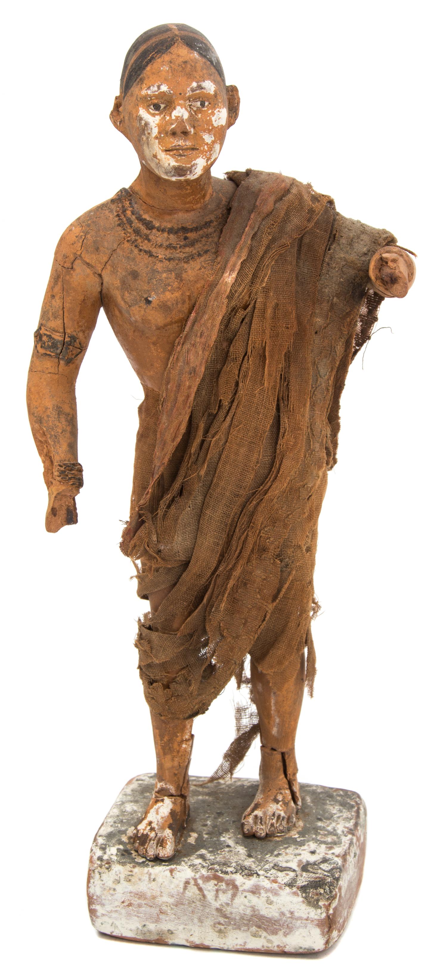 A Painted Wood Standing Figure Height 10 3/4 inches.