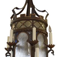 A Bronze and Iron Chandelier from a Chicago Theatre 28" W x 28" D x 75" H — United States, 20th Century