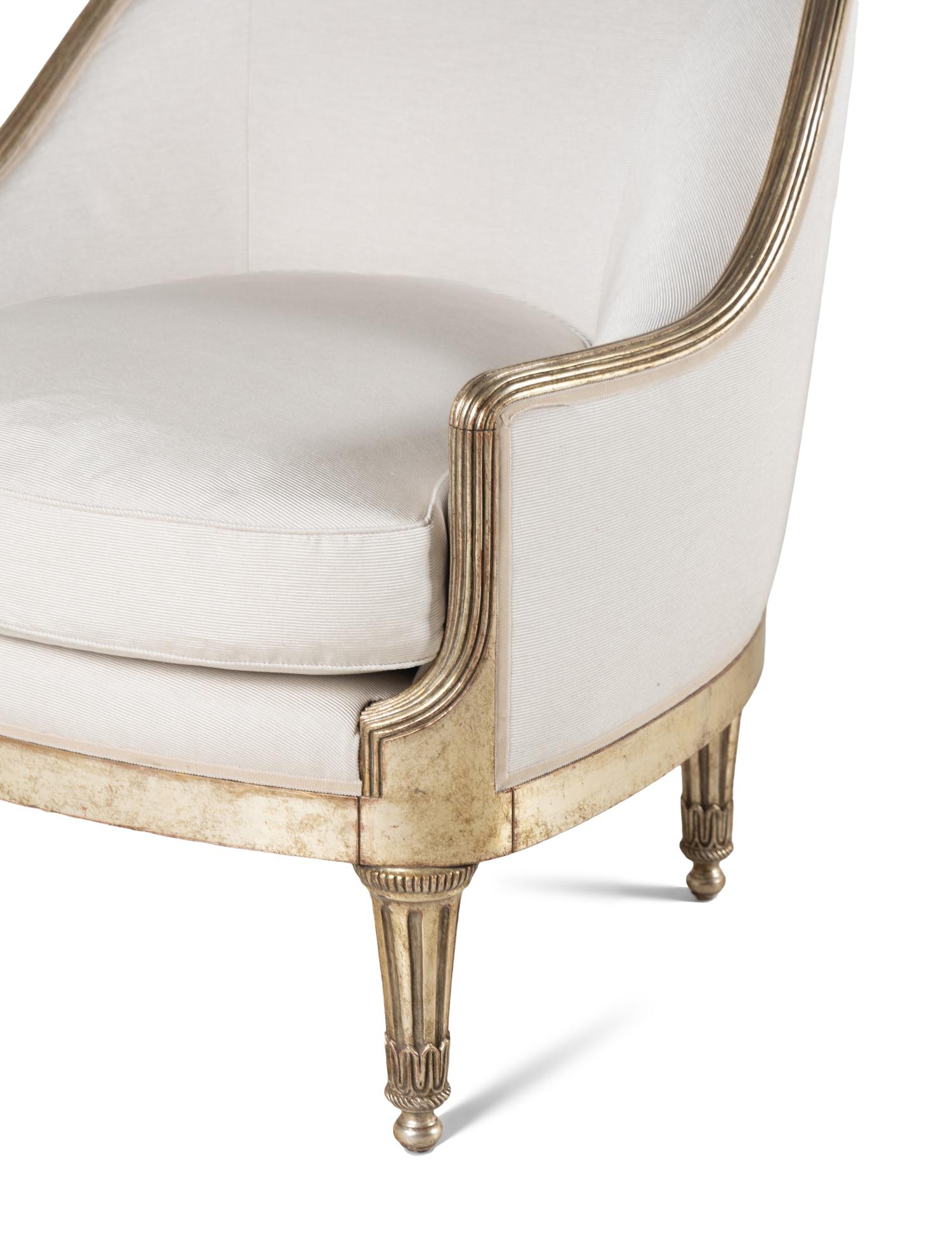 A Pair of Ebanista Silvered Wood Bergeres
