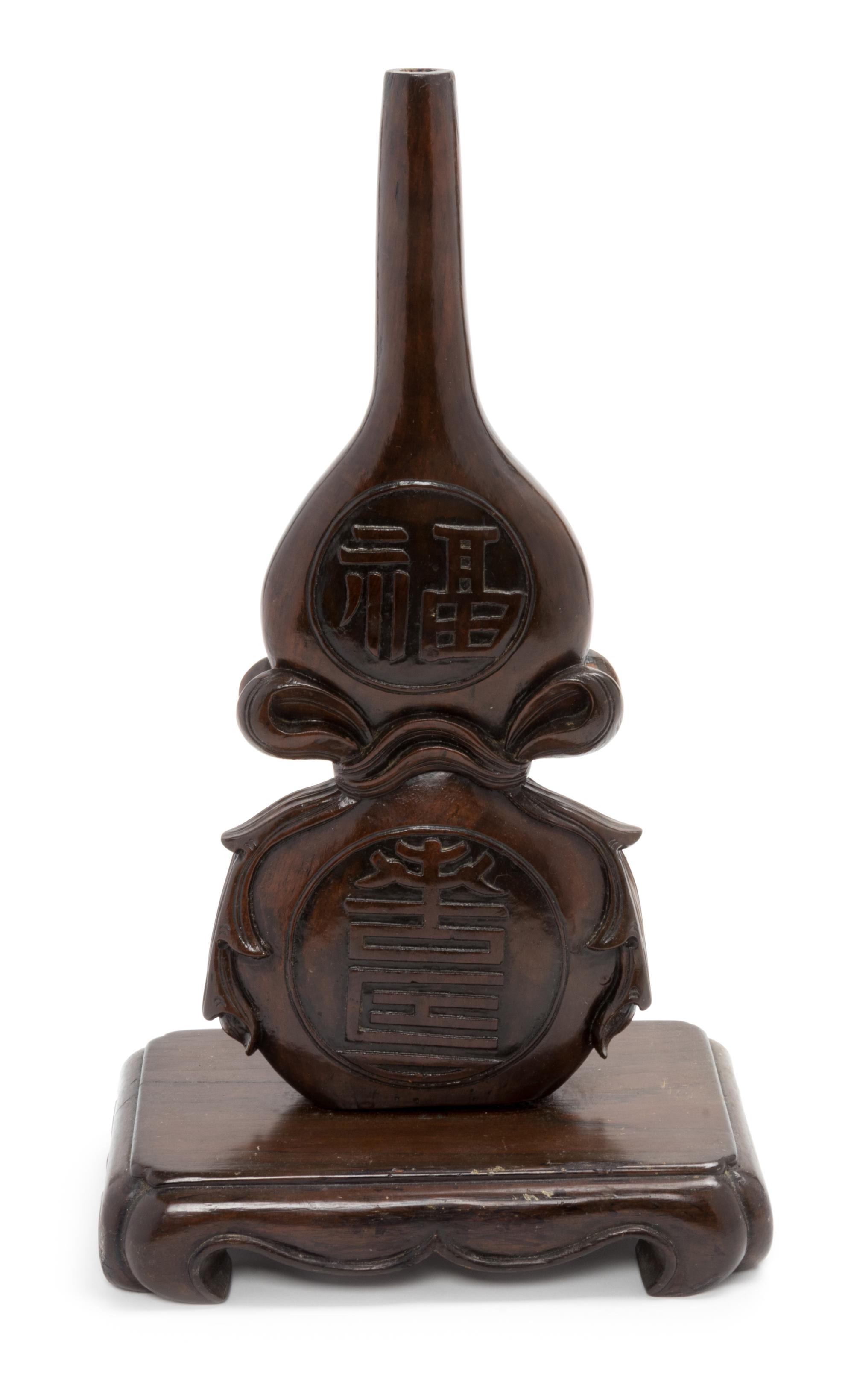 A Chinese Carved Hardwood Gourd-Form Vase Height 17 3/4 inches. — 20TH CENTURY