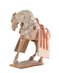 A Painted Pottery Figure of a Prancing Horse Height 12 1/2 inches. — POSSIBLY TANG DYNASTY