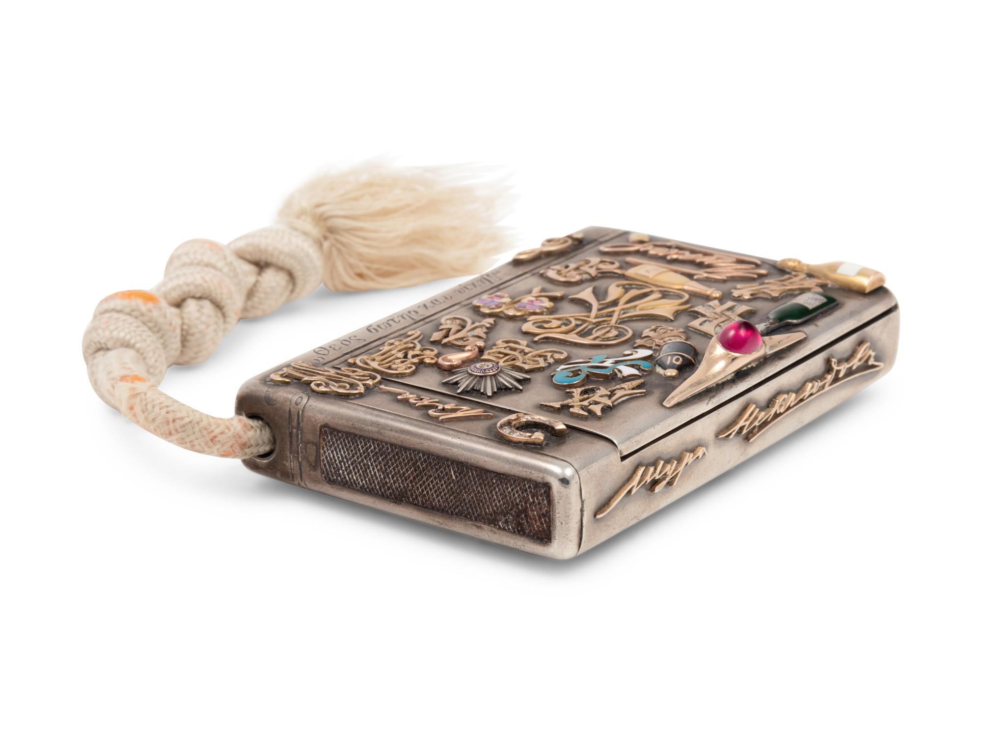 A Russian Silver and Applied Gold and Enamel Charm Decorated Cigarette Case