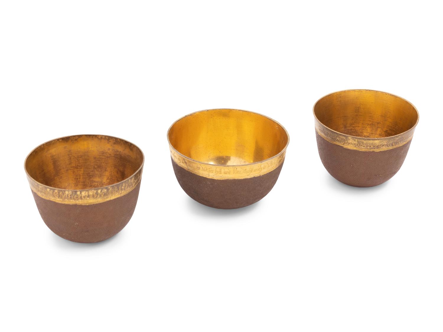 A Group of Three Continental Gilt Metal Herrengrund Cups