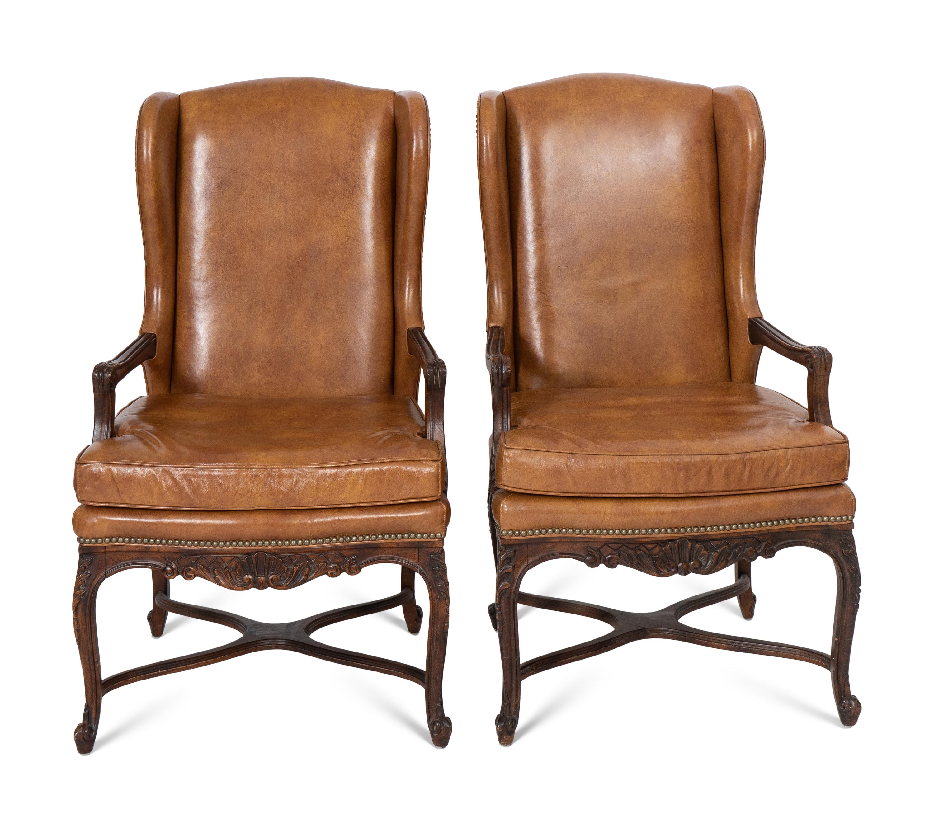A Pair of Régence Style Leather-Upholstered Wingback Fauteils