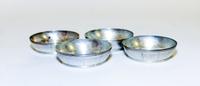 A Set of Four American Silver Butter Dishes, Tiffany & Co., New York, NY, or circular form with reeded banding along rim and base.