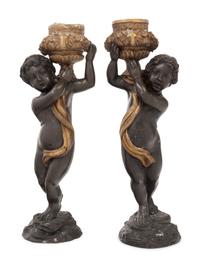 A Pair of Gilt and Patinated Bronze Figures of Cherubs