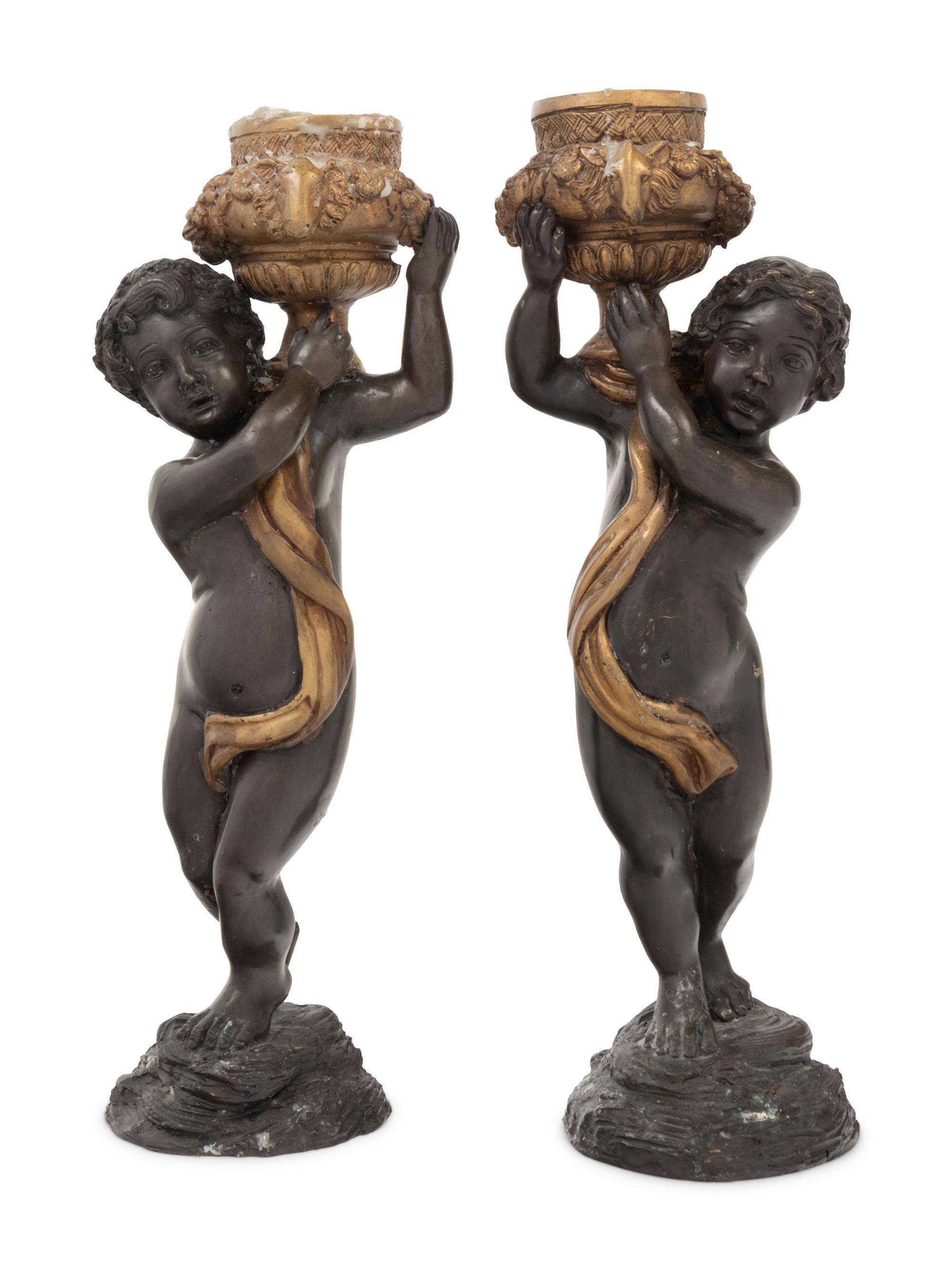 A Pair of Gilt and Patinated Bronze Figures of Cherubs