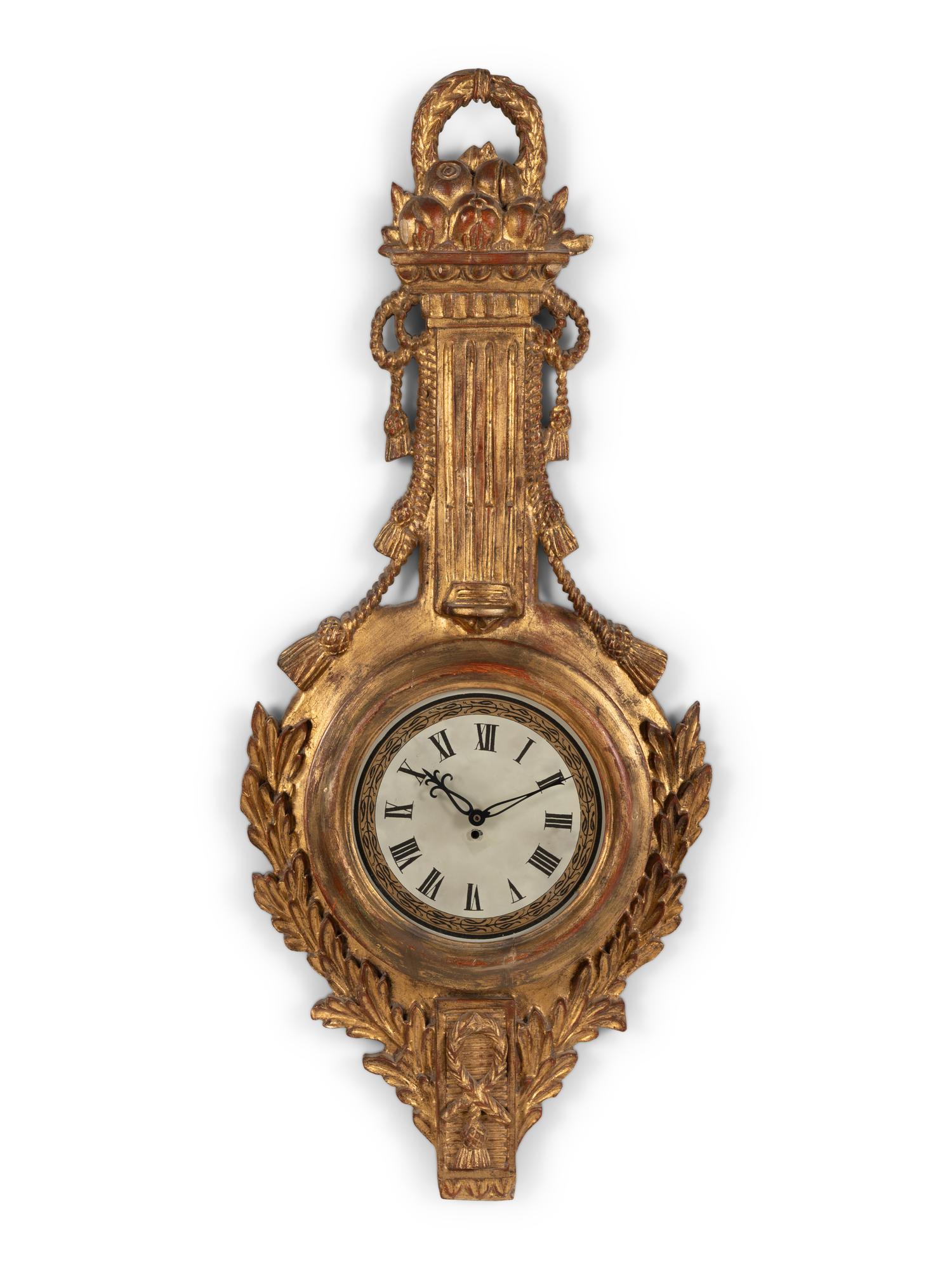 A Louis XVI Style Giltwood Cartel Clock