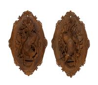A Pair of Swiss "Black Forest" Carved Lindenwood Game Plaques
