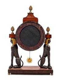 A French Egyptian Revival Gilt Bronze Mounted Mahogany Clock