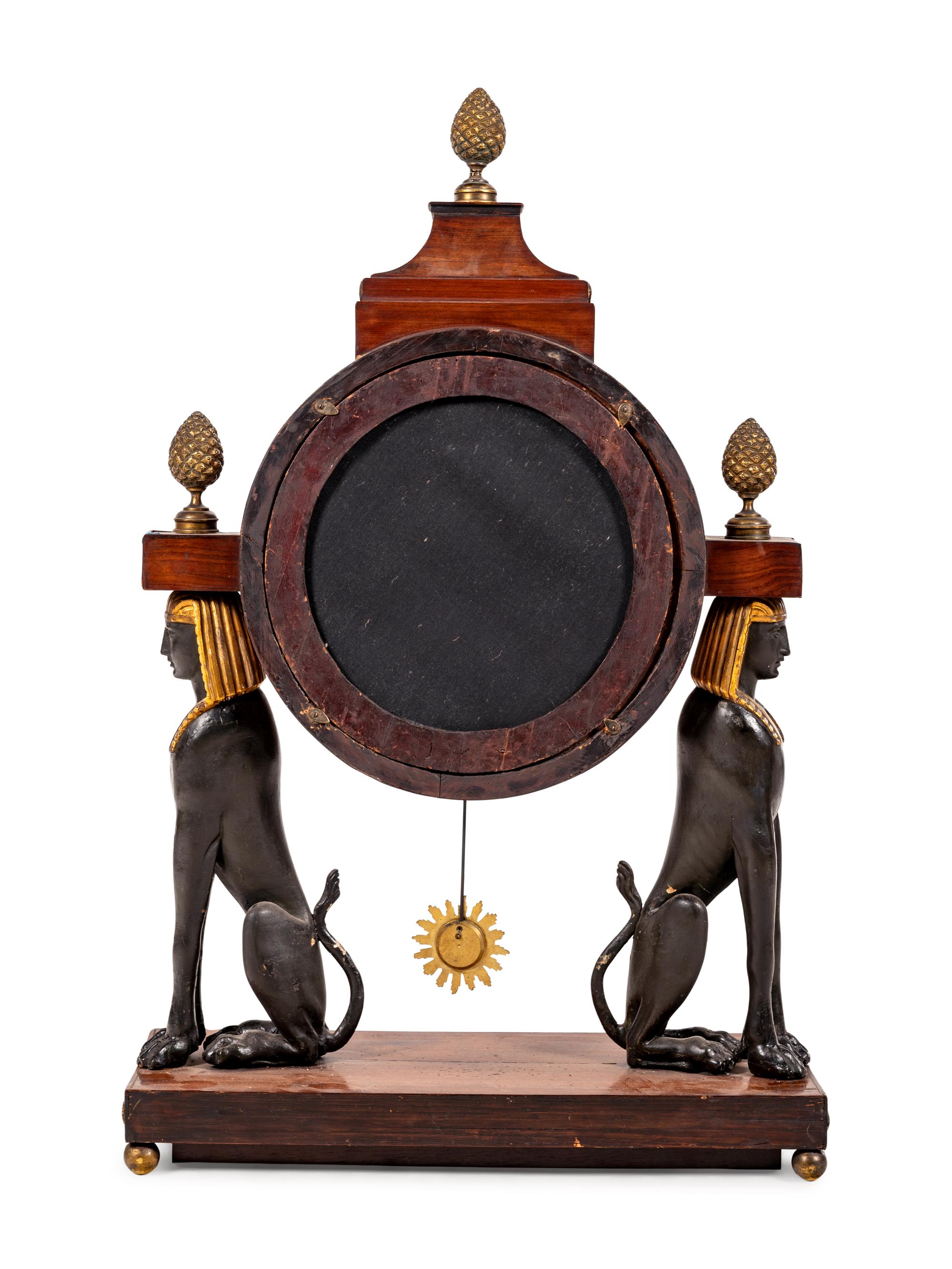 A French Egyptian Revival Gilt Bronze Mounted Mahogany Clock