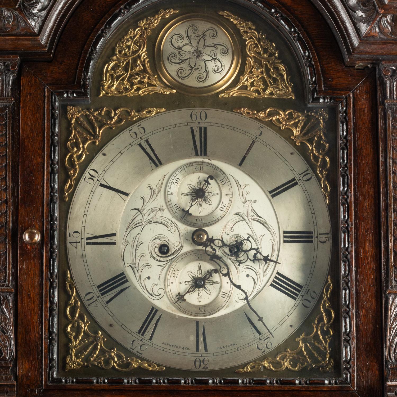 An English Carved Oak Tall Case Clock
