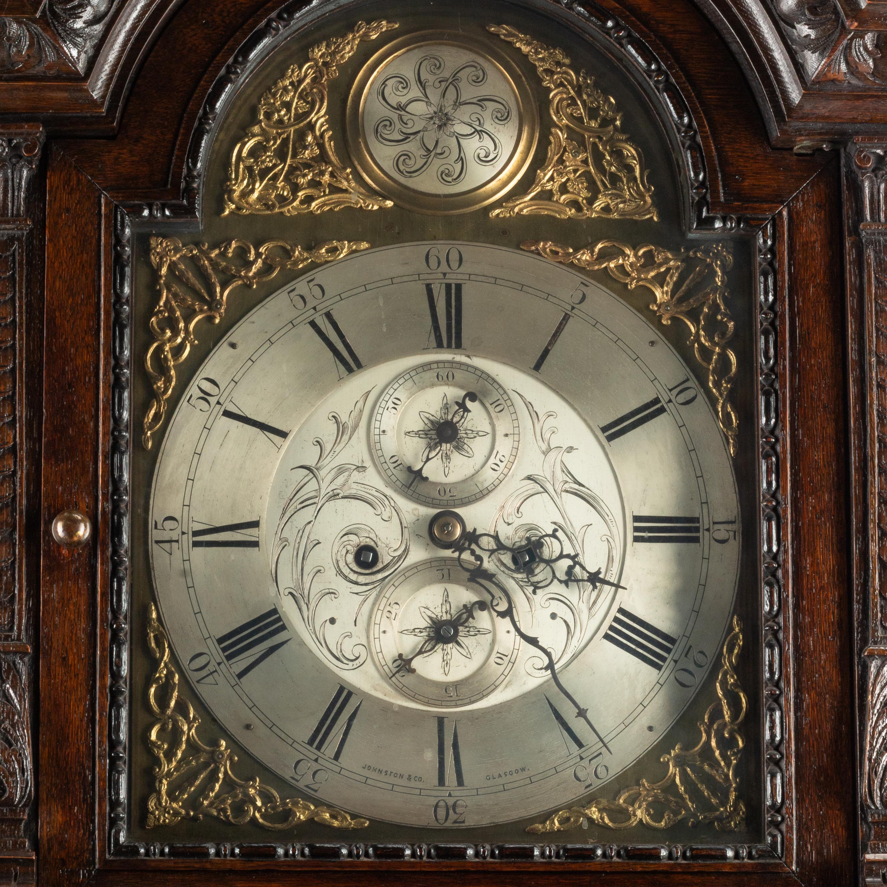 An English Carved Oak Tall Case Clock