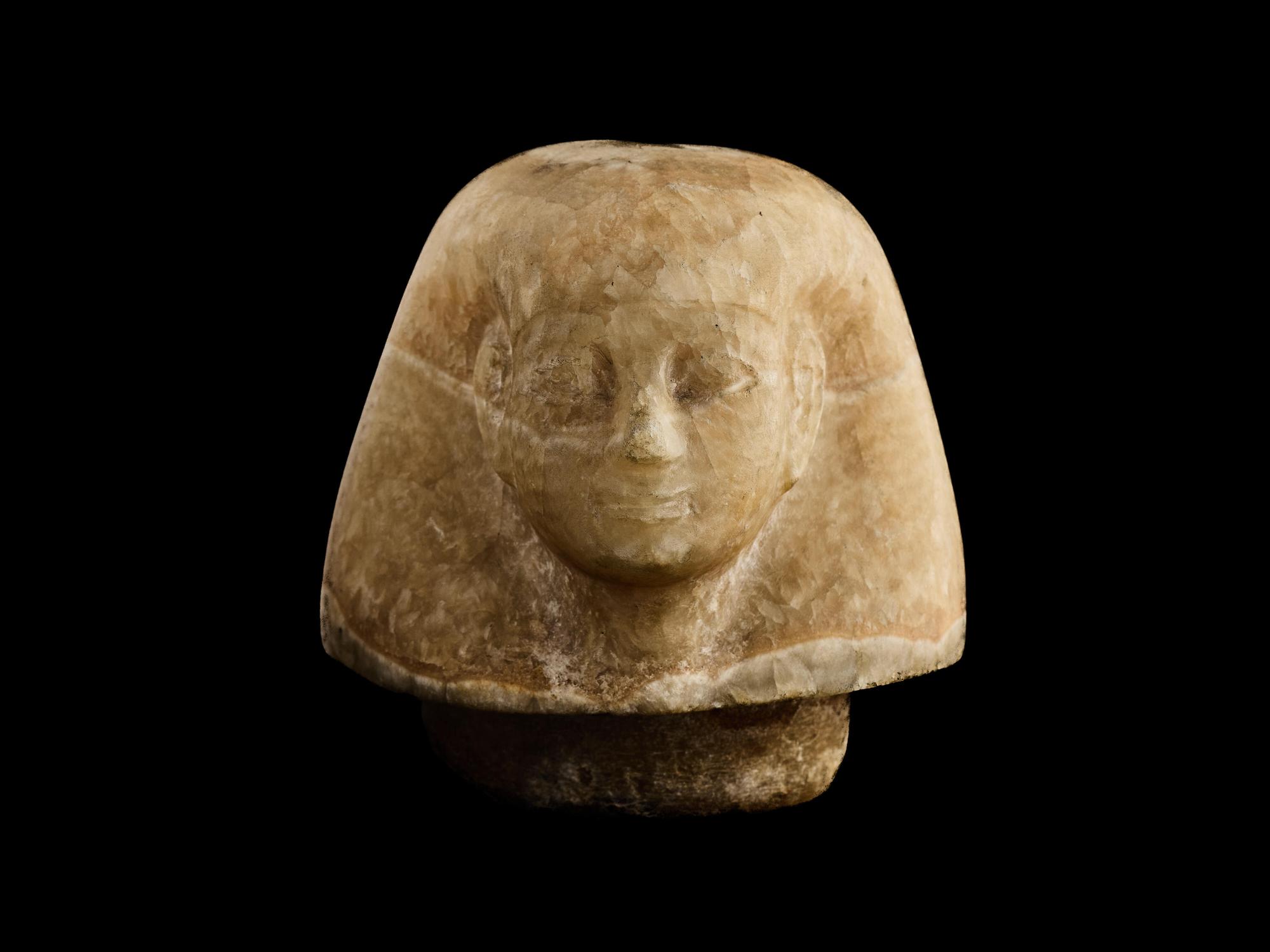 An Egyptian Alabaster Canopic Jar Lid