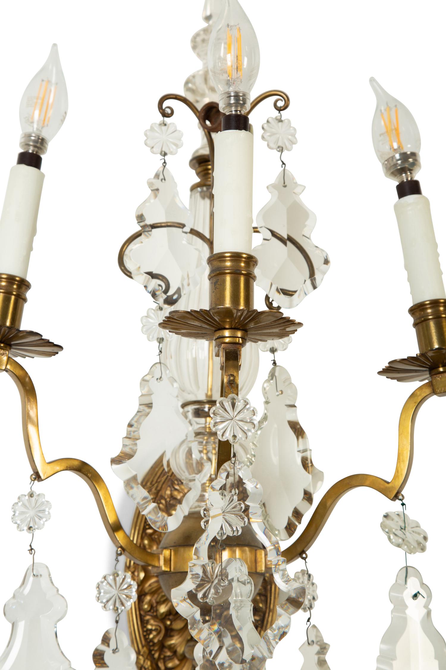 A Pair of Louis XV Style Gilt Bronze and Cut Glass Three-Light Sconces