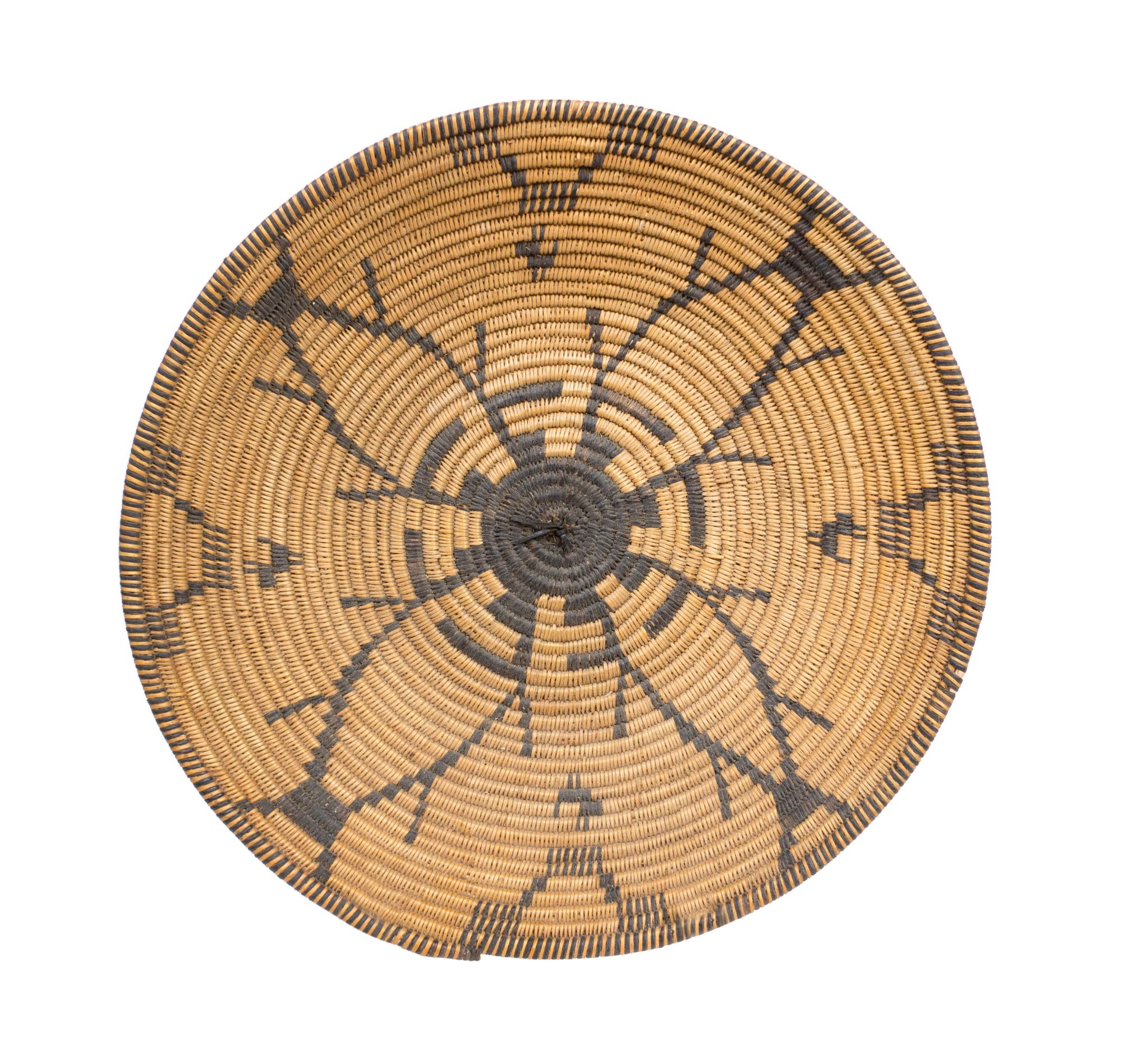 An Apache Basket Tray Height 3 1/4 x diameter 15 3/4 inches.