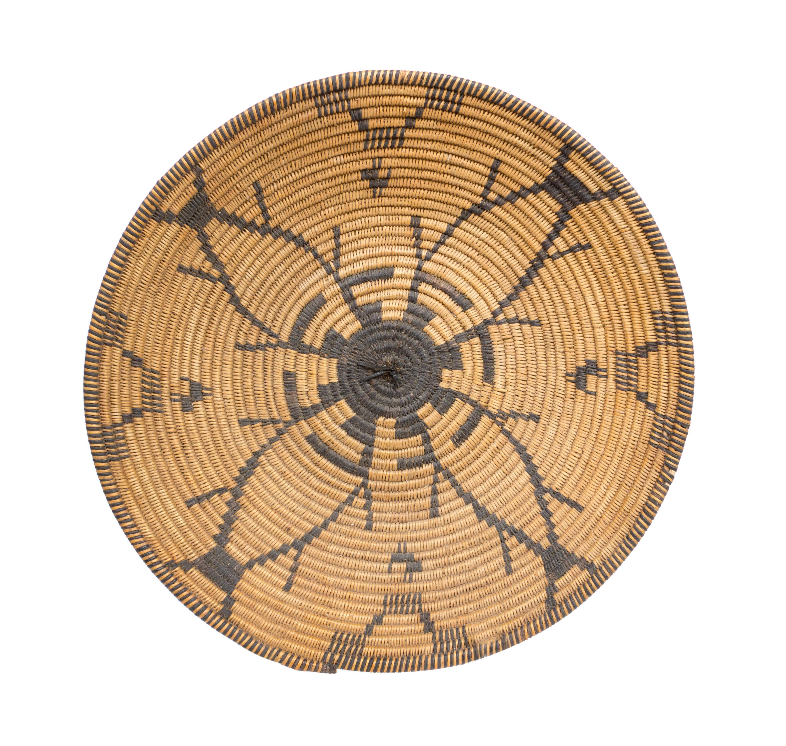 An Apache Basket Tray Height 3 1/4 x diameter 15 3/4 inches.