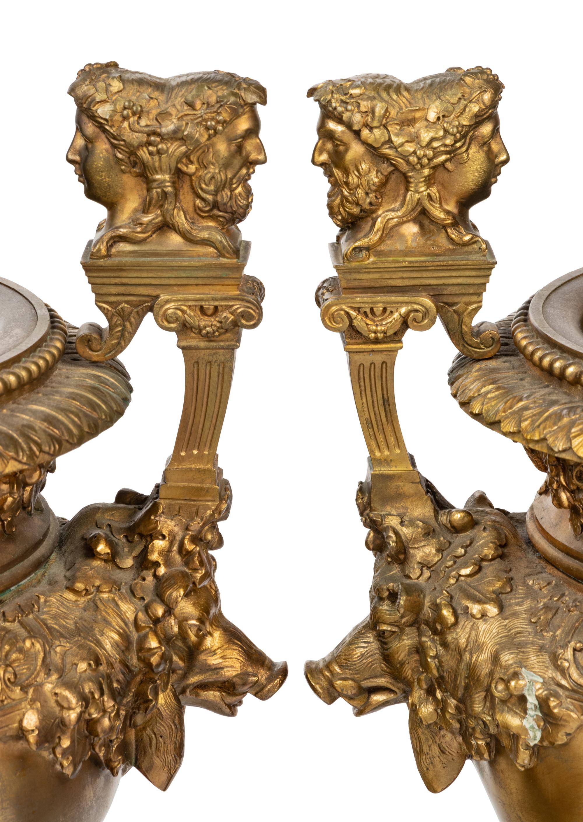 A Pair of Neoclassical Gilt Bronze Urns on Marble Plinths