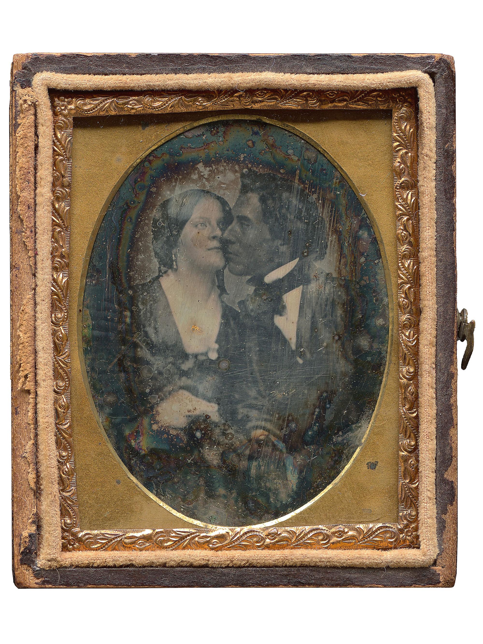 [EARLY PHOTOGRAPHY]. A remarkable ninth plate daguerreotype of an interracial couple.