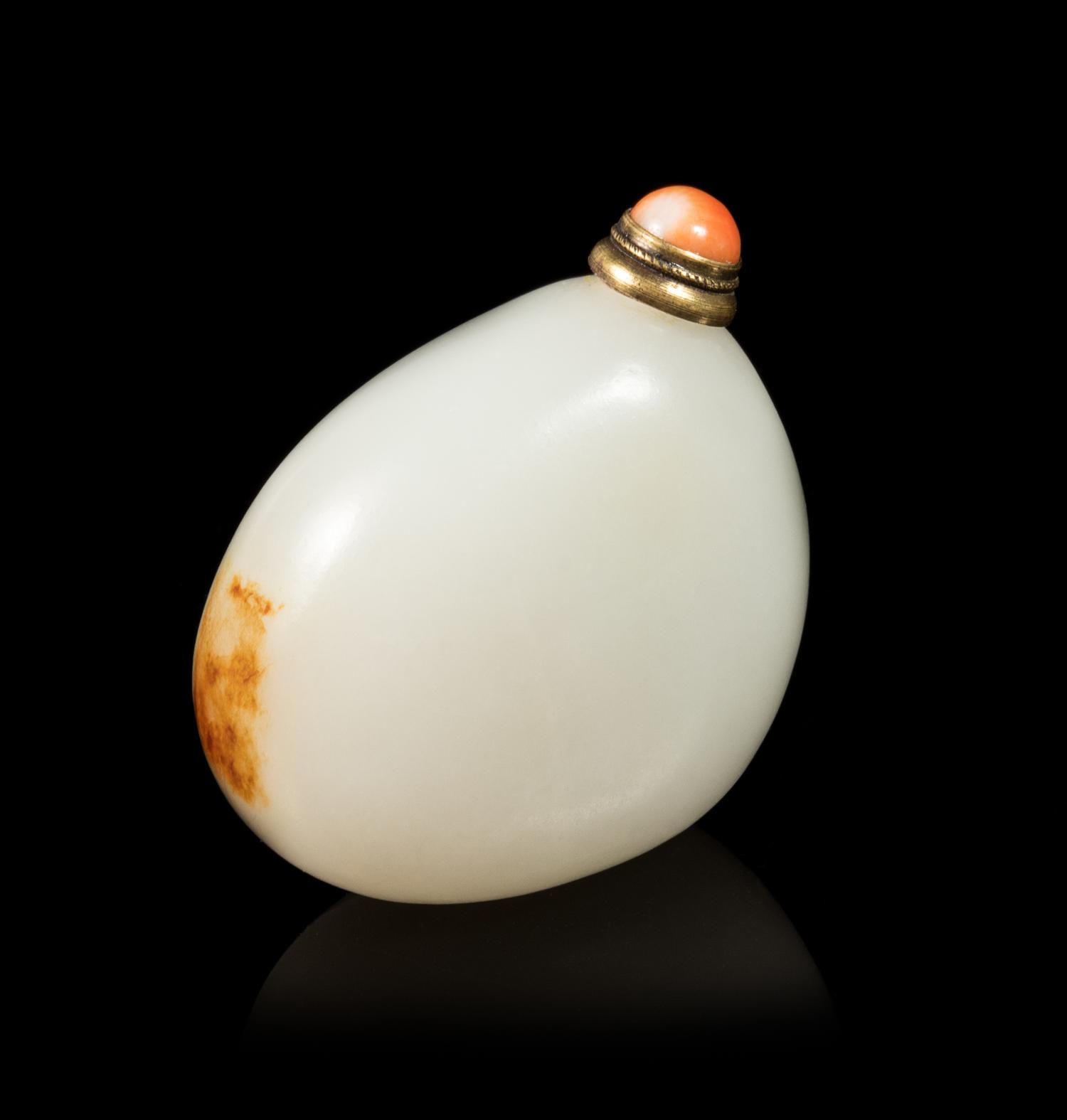 A White and Russet Jade 'Pebble' Snuff Bottle Length 2 inches. — 19TH CENTURY