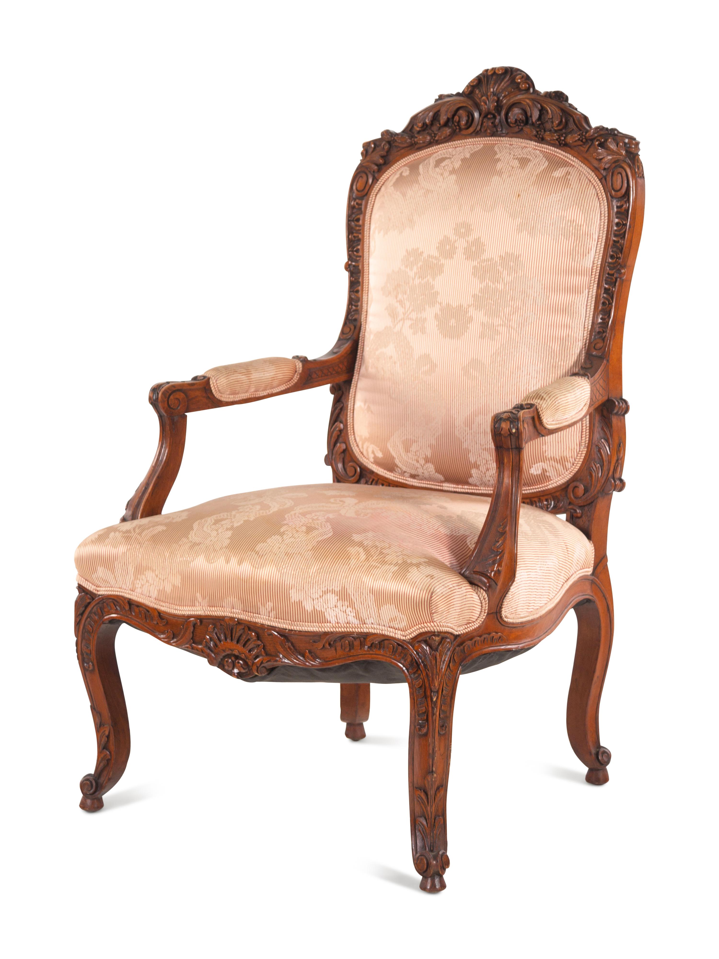 A Louis XV Style Carved Walnut Fauteuil