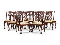A Set of Fourteen George III Style Carved Mahogany Dining Chairs