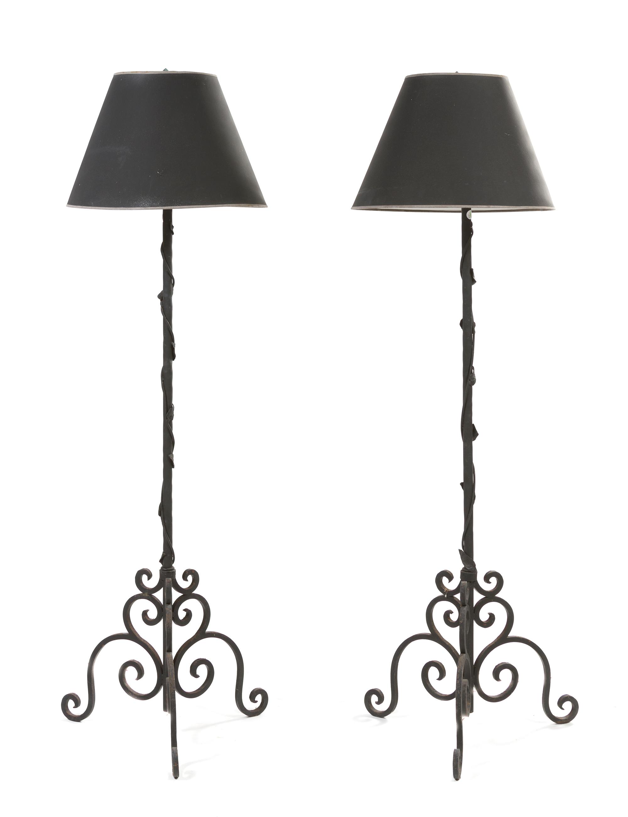 A Pair of Iron Torchieres, Height 74 1/2 inches.