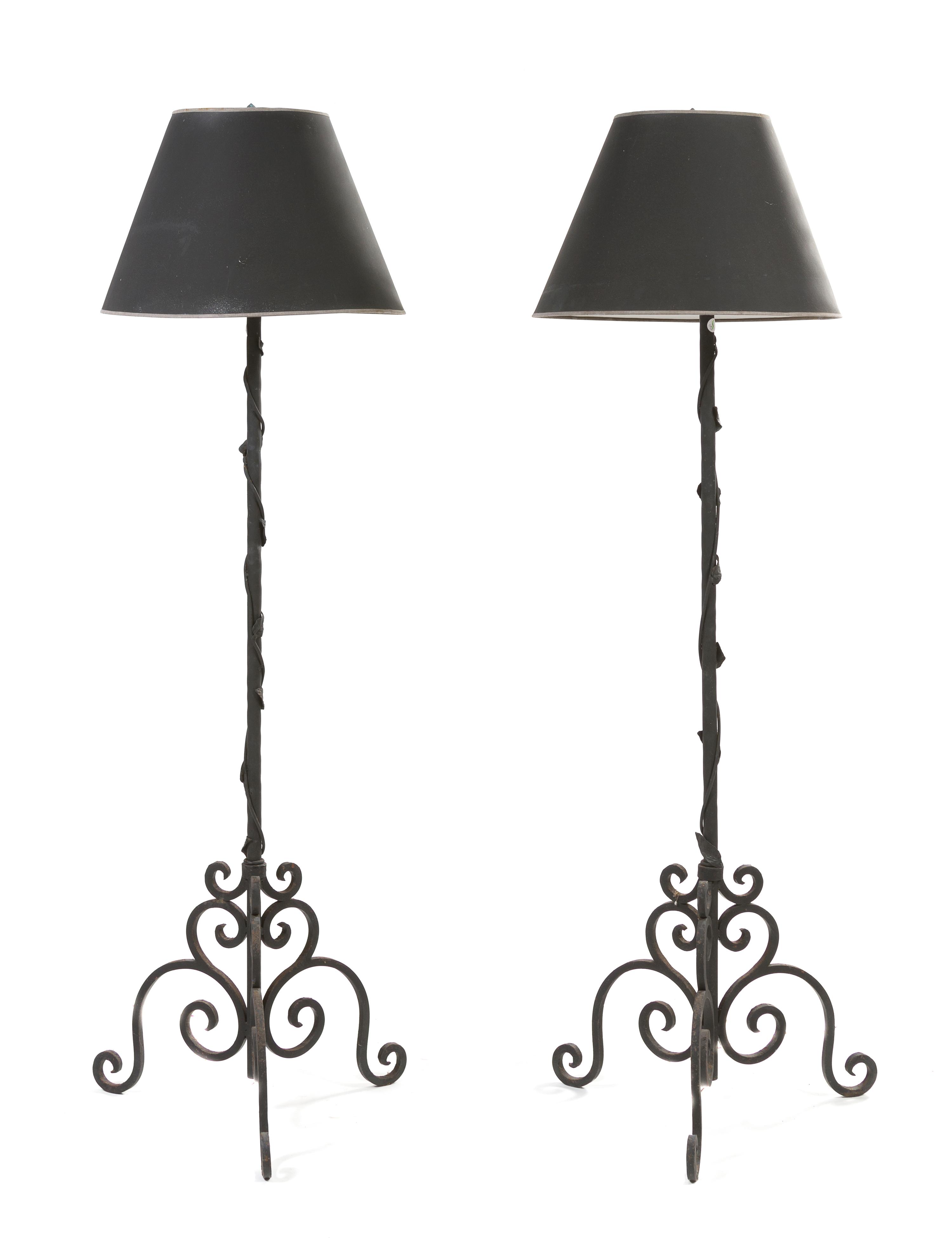 A Pair of Iron Torchieres, Height 74 1/2 inches.