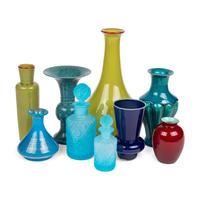 A Collection of Colored Glass and Ceramic Vases and Bottles