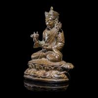 A Tibetan Copper Alloy Seated Figure of Padmasambhava, 16th/17th Century 十六/十七世紀 西藏銅合金銅蓮花生坐像